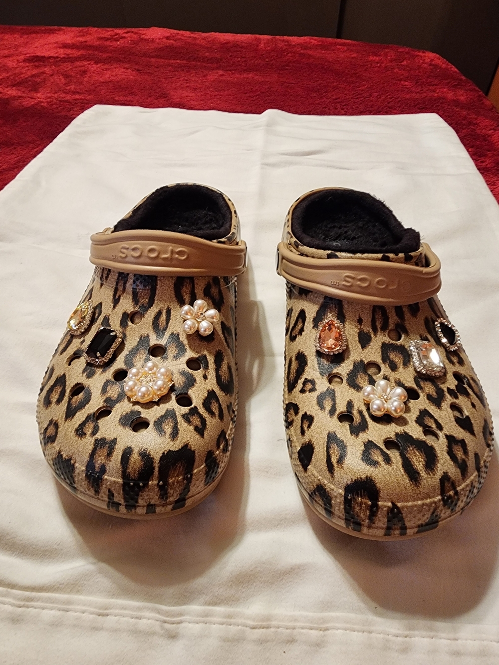 Crocs animal print size M9 W11 with Decorative Gems with soft black lining.